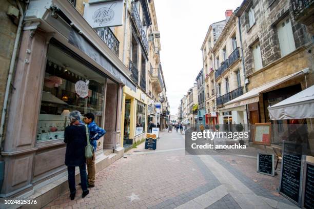 people shopping in bordeaux city center, france - bordeaux street stock pictures, royalty-free photos & images