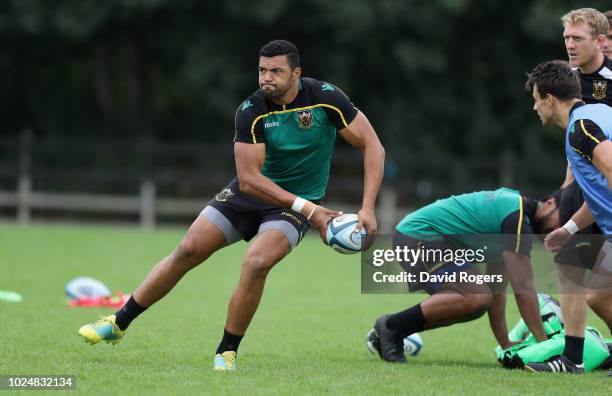 Luther Burrell runs with the ball during the Northampton Saints training session held at Franklin's Gardens on August 28, 2018 in Northampton,...