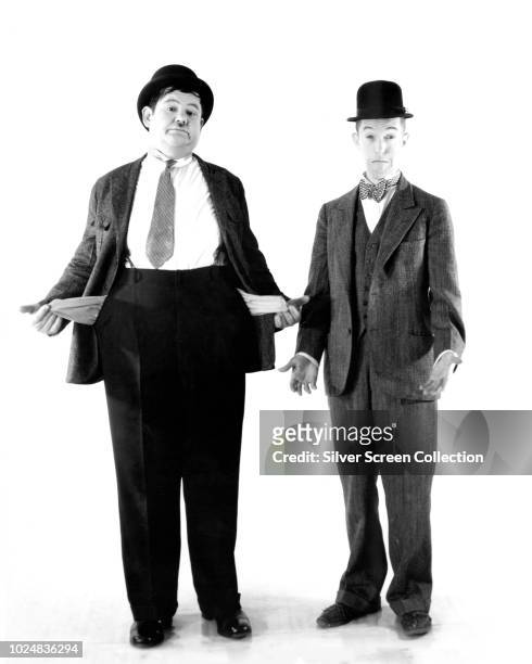 Comedy duo Stan Laurel and Oliver Hardy are broke as usual, circa 1930.