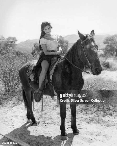 Argentine-American actress Linda Cristal as Elena de la Madriaga in the film 'Two Rode Together', 1961.