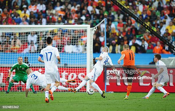 Arjen Robben of the Netherlands scores the first goal during the 2010 FIFA World Cup South Africa Round of Sixteen match between Netherlands and...
