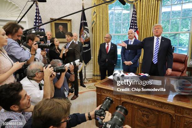 President Donald Trump makes brief remarks to reporters during a meeting with U.S. Soccer President Carlos Cordeiro and FIFA President Gianni...