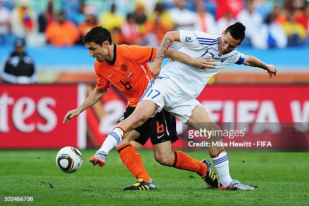 Mark Van Bommel of the Netherlands and Marek Hamsik of Slovakia battle for the ball during the 2010 FIFA World Cup South Africa Round of Sixteen...
