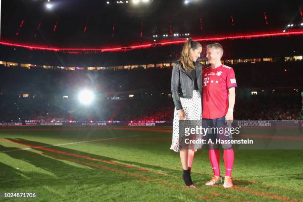 Bastian Schweinsteiger reacts with his wife Ana Ivanovic after the Friendly Match between FC Bayern Muenchen and Chicago Fire at Allianz Arena on...