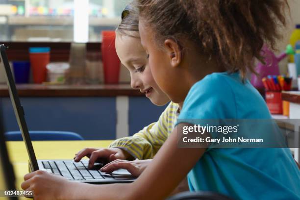 young students use technology to learn - newfamily stock pictures, royalty-free photos & images