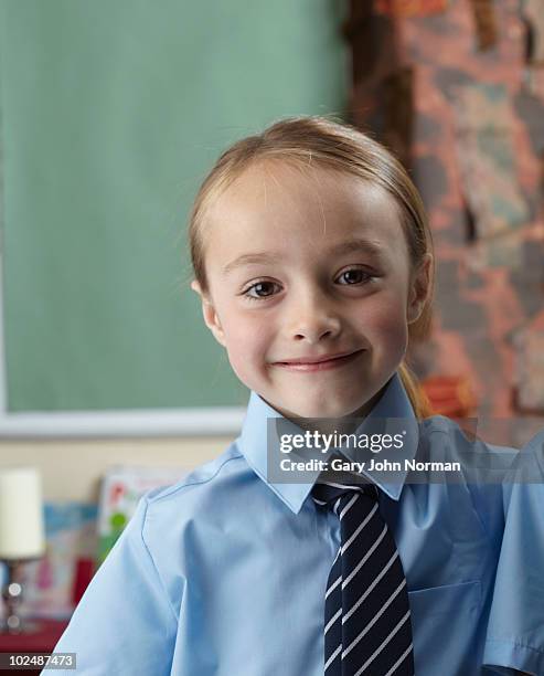 school child  in front of artwork in classroom - newfamily stock pictures, royalty-free photos & images