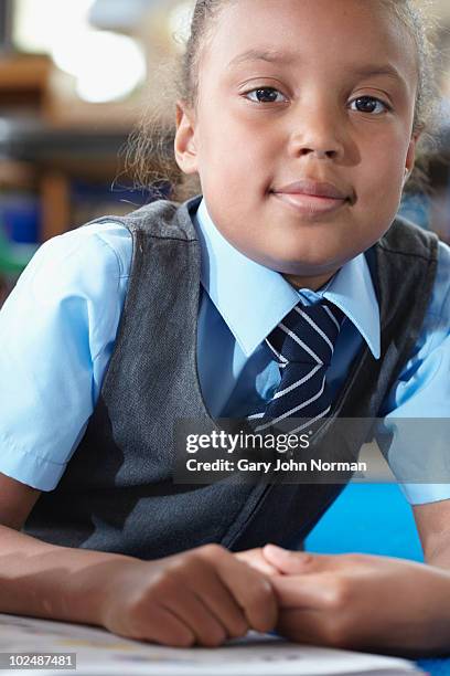 school girl reading book alone. - newfamily stock pictures, royalty-free photos & images