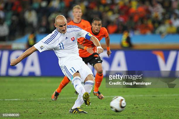 Robert Vittek of Slovakia shoots and scores a late penalty during the 2010 FIFA World Cup South Africa Round of Sixteen match between Netherlands and...