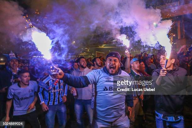 Gremio fans cheer for their team before the match between Gremio and Estudiantes as part of Copa Conmebol Libertadores 2018 at Arena do Gremio on...