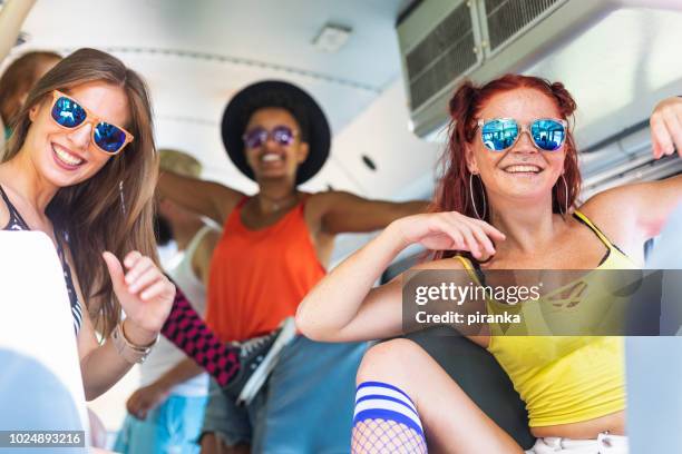 young adults having fun on the bus - party bus stock pictures, royalty-free photos & images