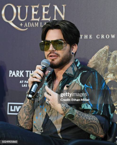 Singer Adam Lambert of Queen + Adam Lambert speaks during a news conference at the MGM Resorts aviation hangar to kick off the group's 10-date...