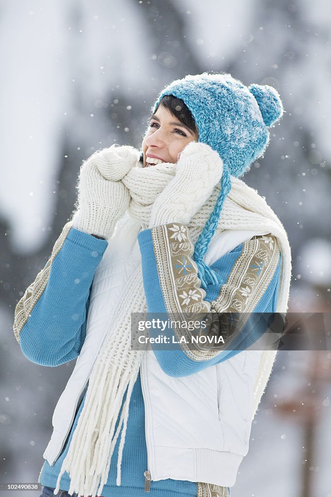 Young woman in winter clothes smiling