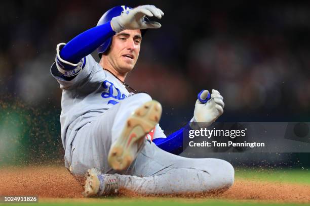 Cody Bellinger of the Los Angeles Dodgers hits a leadoff triple against the Texas Rangers in the top of the seventh inning at Globe Life Park in...