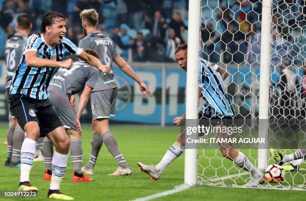 Brazil's Gremio players celebrates after scoring against Argentina's Estudiantes, during their Copa Libertadores 2018 football match held at the...