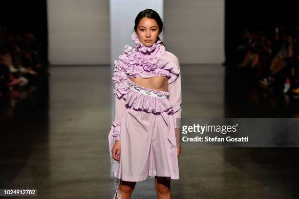 Model walks the runway in a design by Olli during the New Generation show during New Zealand Fashion Week 2018 at Viaduct Events Centre on August 29,...