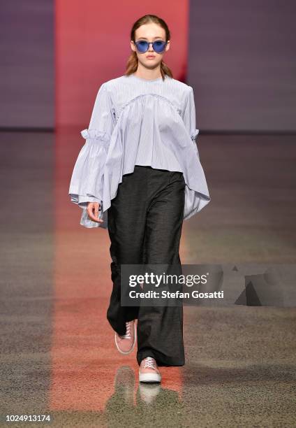 Model walks the runway in a design by Havilah during the New Generation show during New Zealand Fashion Week 2018 at Viaduct Events Centre on August...