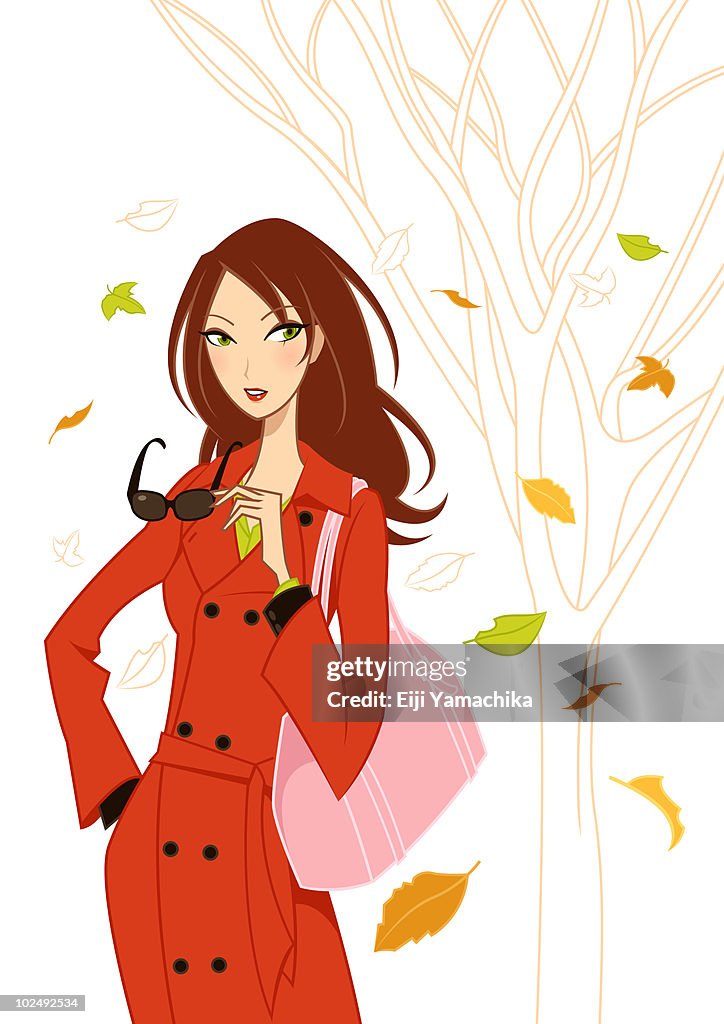 Woman with autumn leaves
