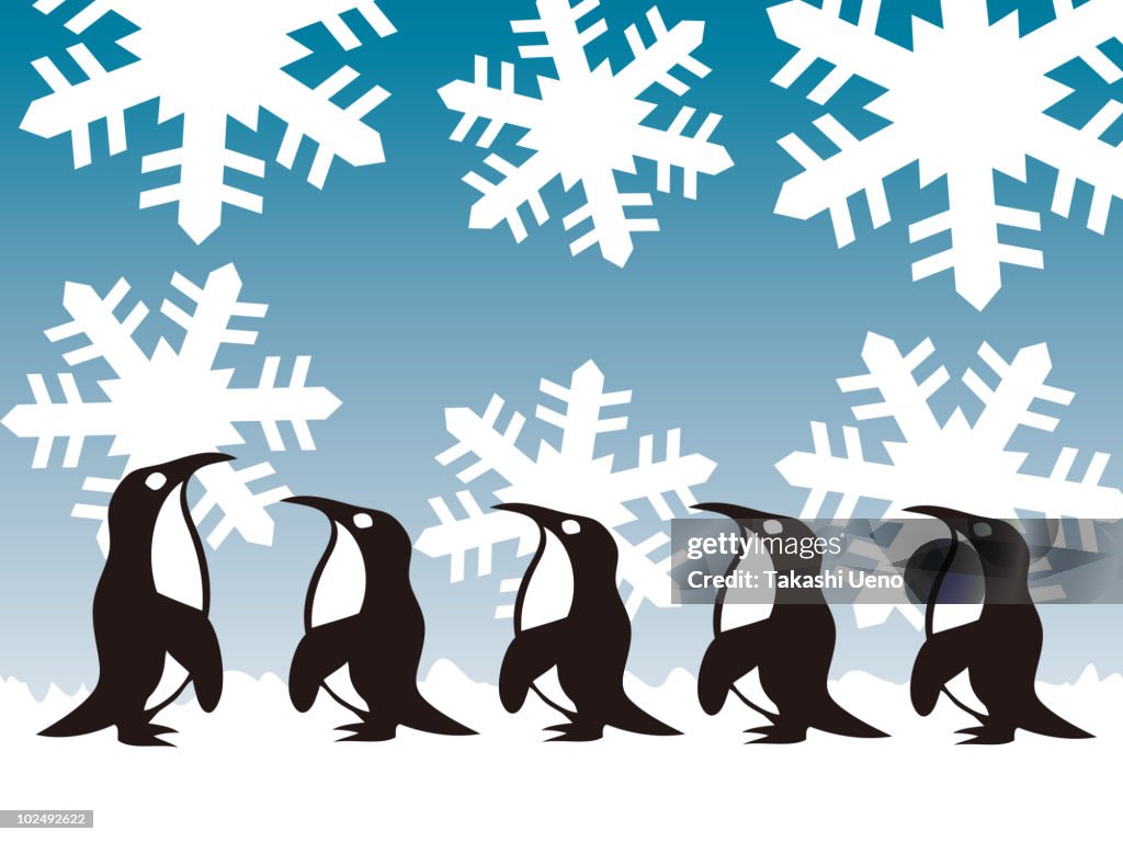 A row of penguins in a row on a snow flake backdrop