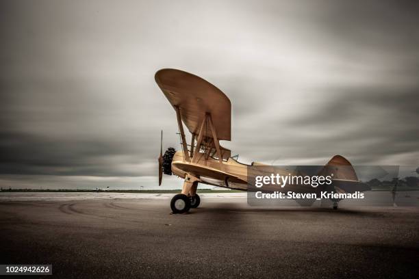 biplane - vintage airplane stock pictures, royalty-free photos & images