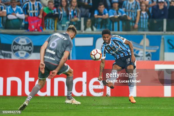 Andre of Gremio battles for the ball against Jonathan Schunke of Estudiantes during the match between Gremio and Estudiantes, part of Copa Conmebol...