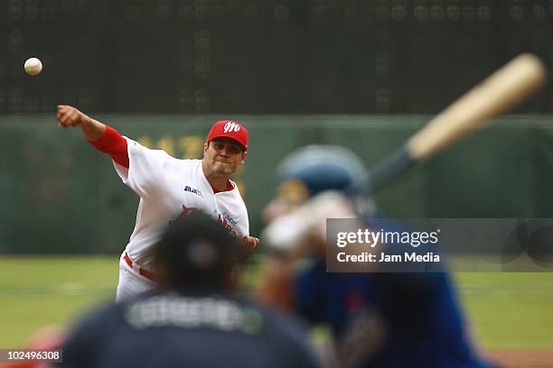 Alfredo Garcia of Diablos Rojos del Mexico throws the ball during a 2010 Liga Mexicana de Beisebol match between Mexico Red Devils and Monclova...