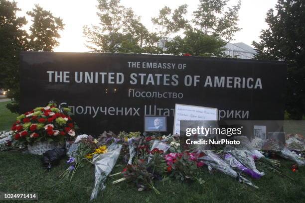 People bring flowers remembering Senator John McCain outside the US Embasy in Kiev, Ukraine, 28 August,2018. Senator John McCain died aged 81 on...