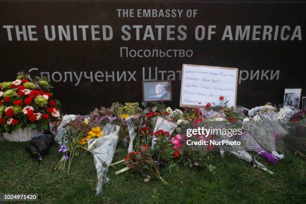 People bring flowers remembering Senator John McCain outside the US Embasy in Kiev, Ukraine, 28 August,2018. Senator John McCain died aged 81 on...