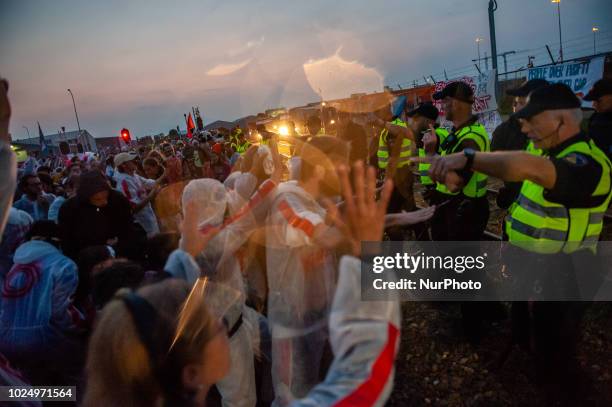 People protest in Farmsum, Netherlands, on August 28, 2018 in front of NAM oil company. Besides the Code Rood civil disobedience action, a completely...