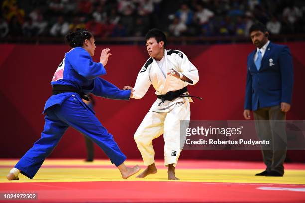 Kalpana Devi Thoudam of India fights against Gulnoza Ziyaeva of Uzbekistan during Women's Judo -52kg Elimination Round of 16 at JCC Plenary Hall on...