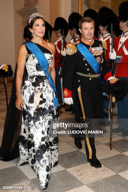 Crown Princess Mary and Crown Prince Frederik of Denmark arrive for the state dinner at Christiansborg Palace in Copenhagen on August 28, 2018.