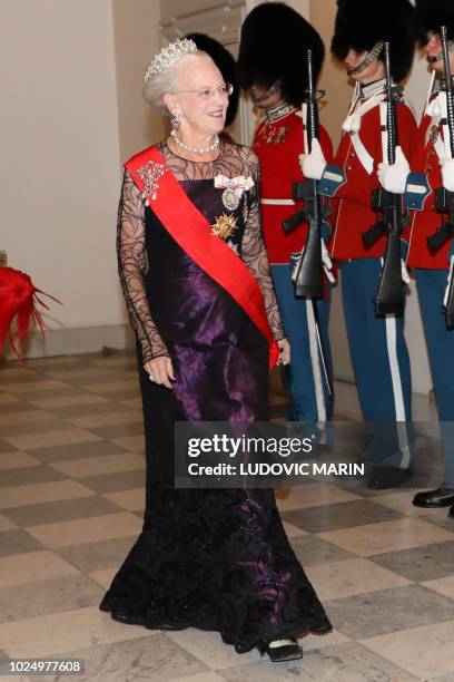 Queen Margrethe II of Denmark arrives for the state dinner at Christiansborg Palace in Copenhagen on August 28, 2018.