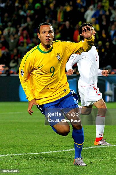 Luis Fabiano of Brazil celebrates scoring his team's second goal during the 2010 FIFA World Cup South Africa Round of Sixteen match between Brazil...