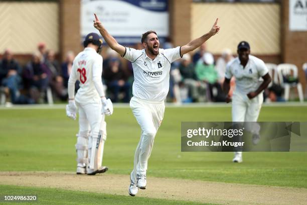Ryan Sidebottom of Warwickshire celebrates the wicket of Jack Murphy of Glamorgan during day 1 of the Specsavers County Championship: Division Two...