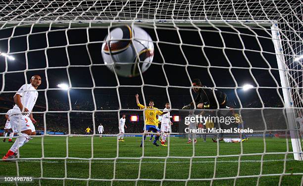 Juan of Brazil heads in his side's first goal from a corner past Claudio Bravo of Chile during the 2010 FIFA World Cup South Africa Round of Sixteen...