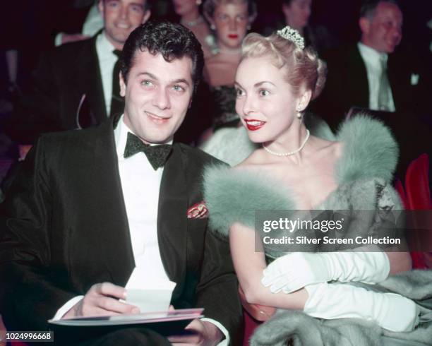 Married American actors Tony Curtis and Janet Leigh at a formal event, circa 1955.