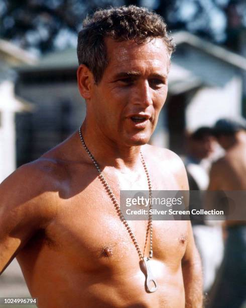 American actor Paul Newman as Luke, wearing a bottle opener around his neck in the film 'Cool Hand Luke', 1967.