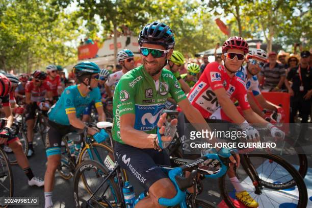 Movistar's Spanish cyclist Alejandro Valverde and Team Sky's Polish cyclist Michal Kwiatkowski wait for the start of the fifth stage of the 73rd...