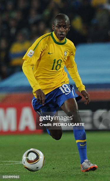 Brazil's midfielder Ramires runs with the ball during the 2010 World Cup round of 16 football match Brazil vs. Chile on June 28, 2010 at Ellis Park...
