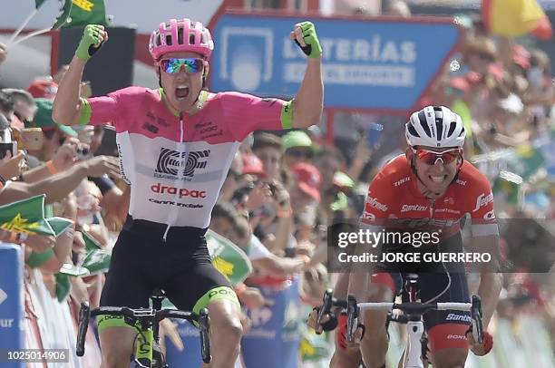 Education First-Drapac's Australian cyclist Simon Clarke celebrates as he crosses first the finish line followed by Trek-Segafredo's Dutch cyclist...