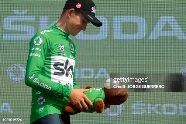 Team Sky's Polish cyclist Michal Kwiatkowski celebrates with the Green Jersey on the podium after the fifth stage of the 73rd edition of "La Vuelta"...