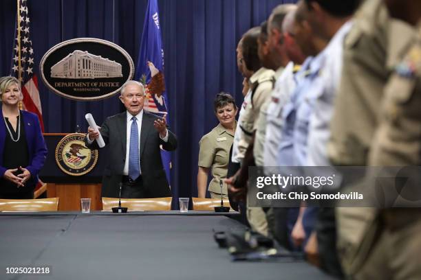 Attorney General Jeff Sessions welcomes guests for a round table event with the Joint Interagency Task Force - South foreign liaison officers with...