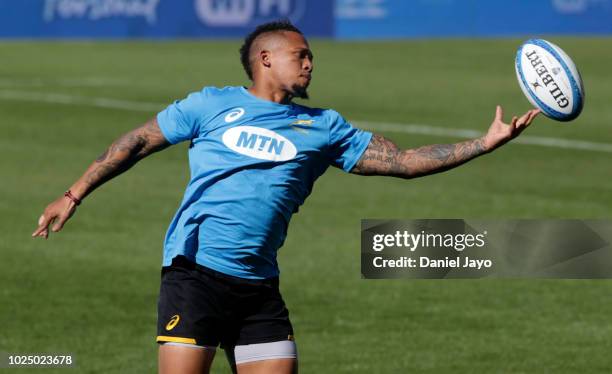 Elton Jantjies plays with the rugby ball during South Africa Captain's Run before the The Rugby Championship 2018 match against South Africa at...