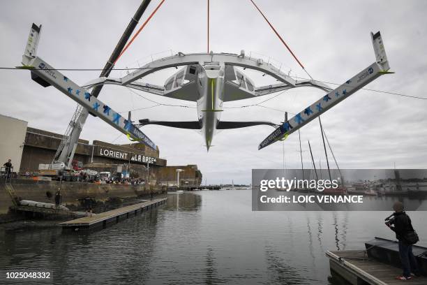 French Skipper Armel Le Cleach's Ultim multihull Banque Populaire is launched on August 29, 2018 in Lorient, western France, a few weeks prior to the...