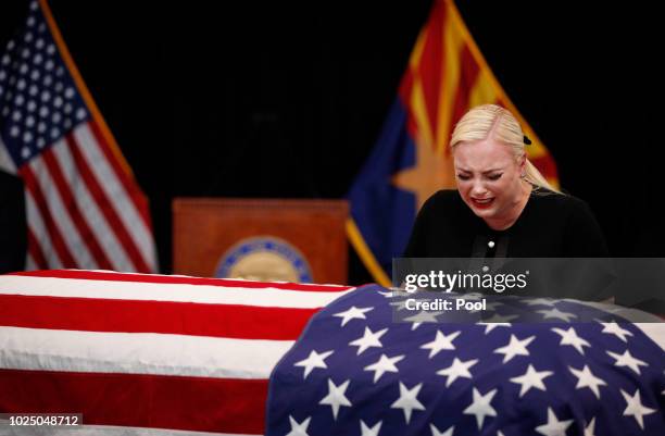 Meghan McCain, daughter of Sen. John McCain, touches the casket during a memorial service at the Arizona Capitol on August 29 in Phoenix, Arizona....