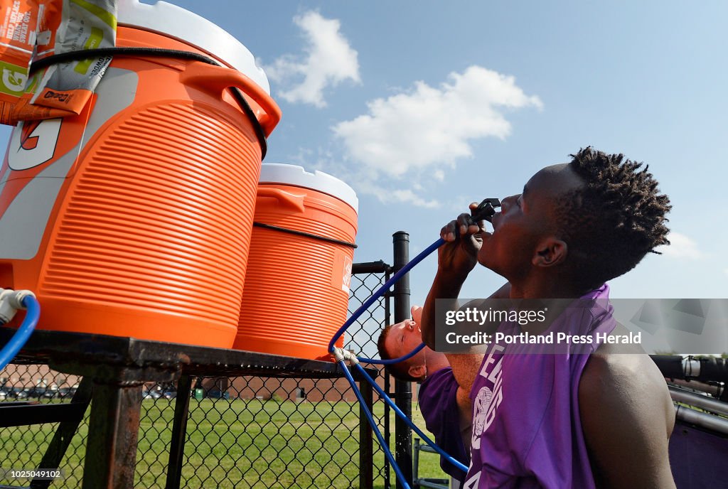 Deering High School football practices in the heat