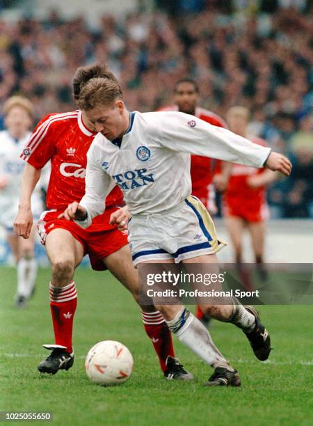 David Batty of Leeds United competes with Peter Beardsley of Liverpool during the Barclays League Division One match between Leeds United and...