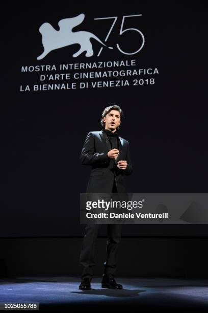 Host of the festival Michele Riondino speaks during the opening ceremony and the 'First Man' screening during the 75th Venice Film Festival at Sala...