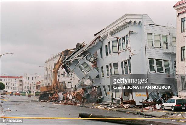 The front of an apartment building in the Marina District in San Francisco is ripped off 21 October 1989 October 1989 after a quake erupted 17...