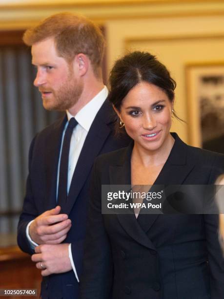 Prince Harry, Duke of Sussex and Meghan, Duchess of Sussex attend a gala performance of "Hamilton" in support of Sentebale at Victoria Palace Theatre...