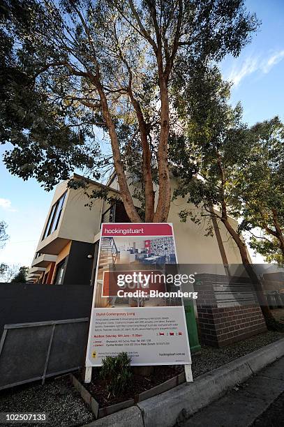 Sold" sticker has been added to a sign advertising a house for sale in East Brunswick, a northern suburb of Melbourne, Australia, on Monday, June 28,...